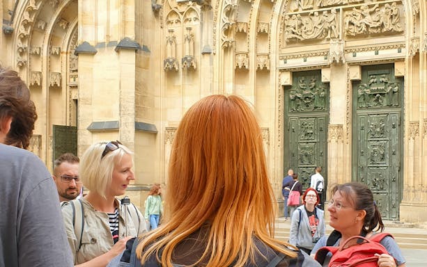 Tour group at Prague Castle entrance during guided tour.