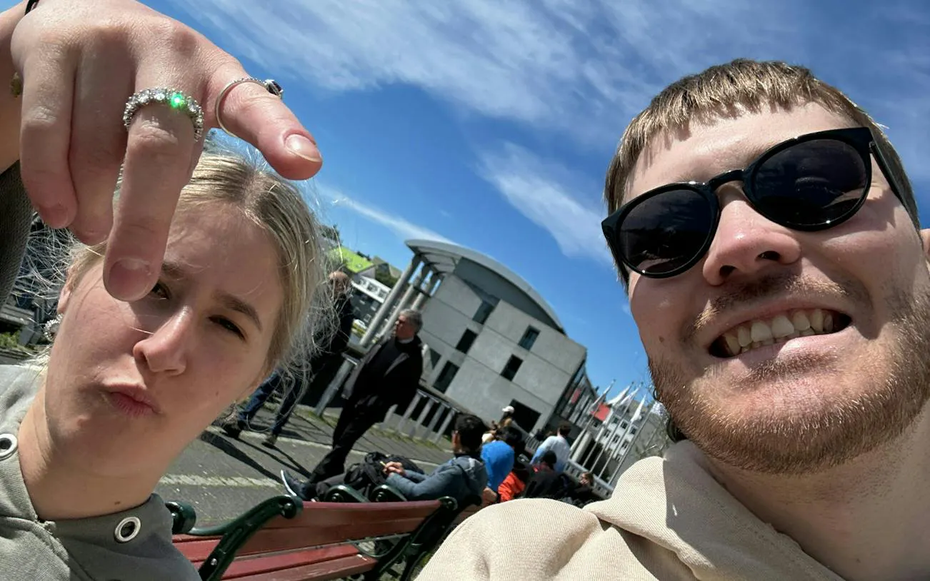 Selfie in Reykjavik city center with modern architecture in the background.