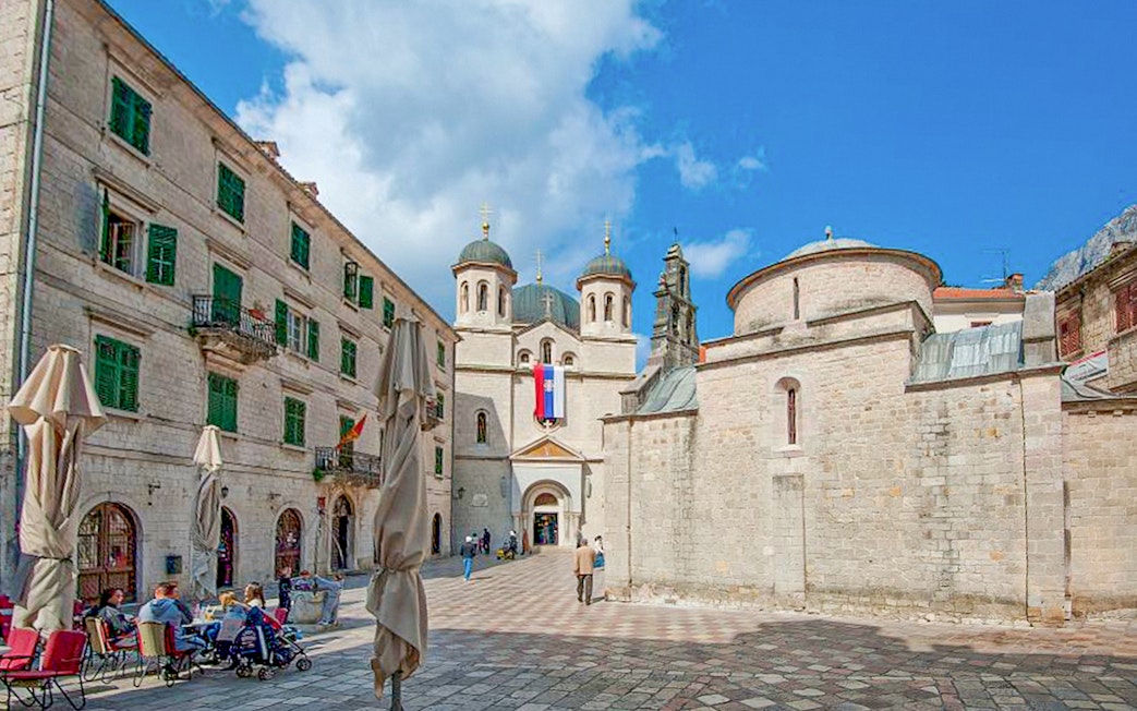 Church of St. Nicholas with people in the square, Kotor, Montenegro.