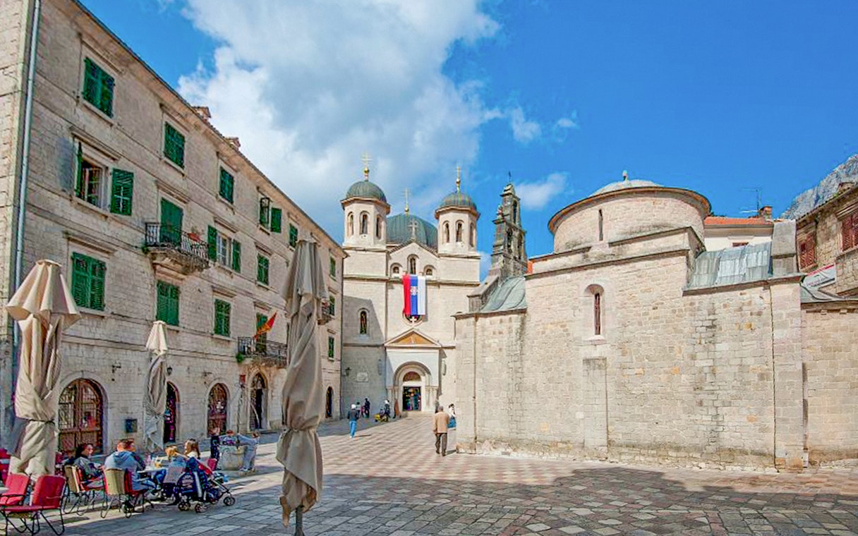 Church of St. Nicholas with people in the square, Kotor, Montenegro.