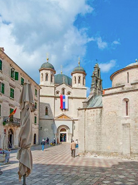Church of St. Nicholas with people in the square, Kotor, Montenegro.