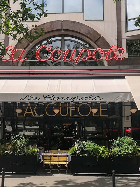 La Coupole restaurant facade on Montparnasse Walking Tour, Paris.