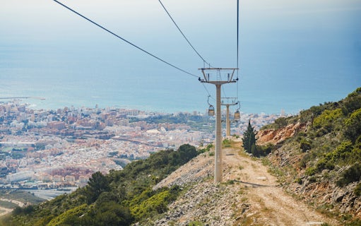 Benalmádena Cable Car ascending with city and sea view in the background.