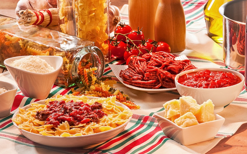 Italian pasta with tomato sauce and cheese on a table in Rome.