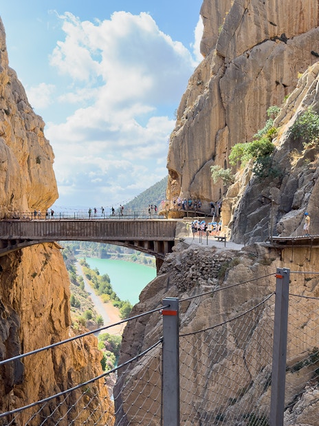 Caminito del Rey walkway between cliffs with tourists, near Granada and Seville, Spain.
