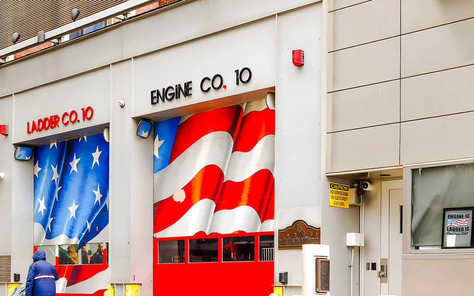 FDNY Ten House with American flag mural on garage doors, New York City.