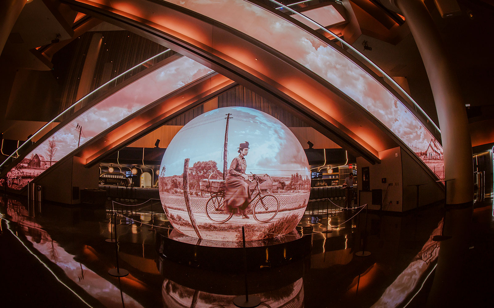 Projection of a cyclist scene from Wizard of Oz at Sphere venue.