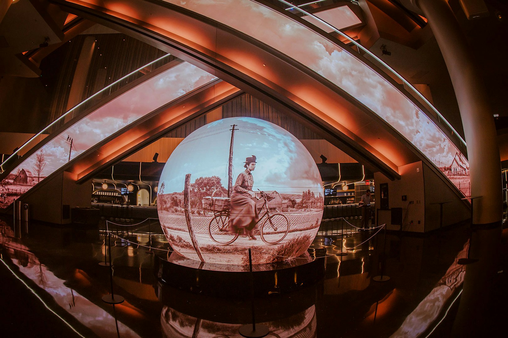 Projection of a cyclist scene from Wizard of Oz at Sphere venue.