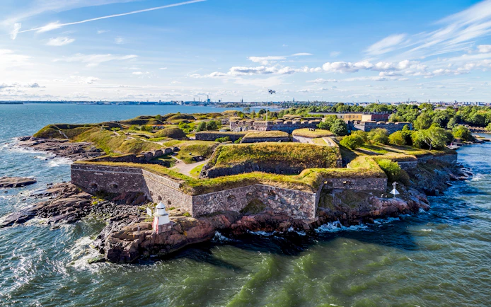 Suomenlinna sea fortress on an island in Helsinki, Finland, surrounded by water.