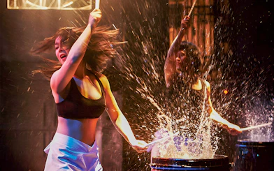 Performers drumming energetically at Seoul Myeongdong Nanta Musical Show.