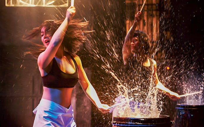 Performers drumming energetically at Seoul Myeongdong Nanta Musical Show.