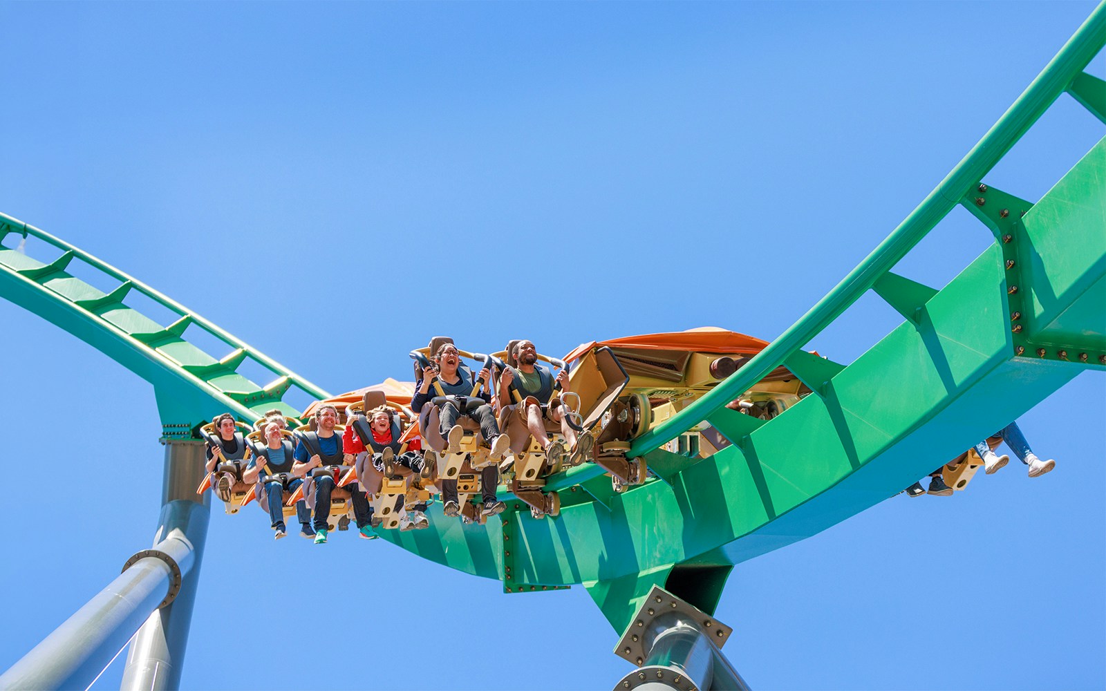Roller coaster riders on Rapterra at Six Flags King's Dominion.