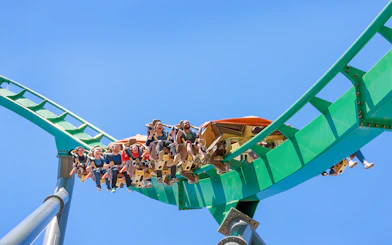 Roller coaster riders on Rapterra at Six Flags King's Dominion.