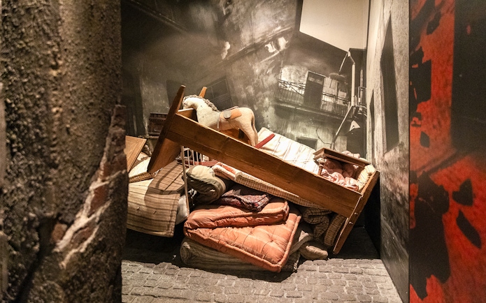Piled furniture and belongings in the Liquidation exhibit at Oskar Schindler's Factory.