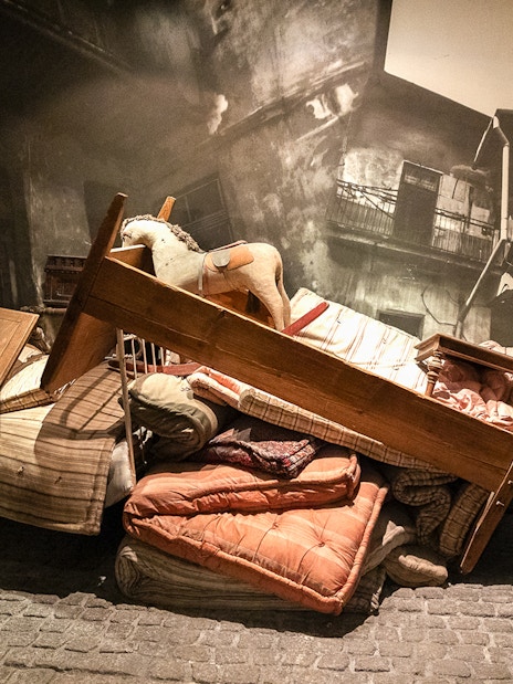 Piled furniture and belongings in the Liquidation exhibit at Oskar Schindler's Factory.