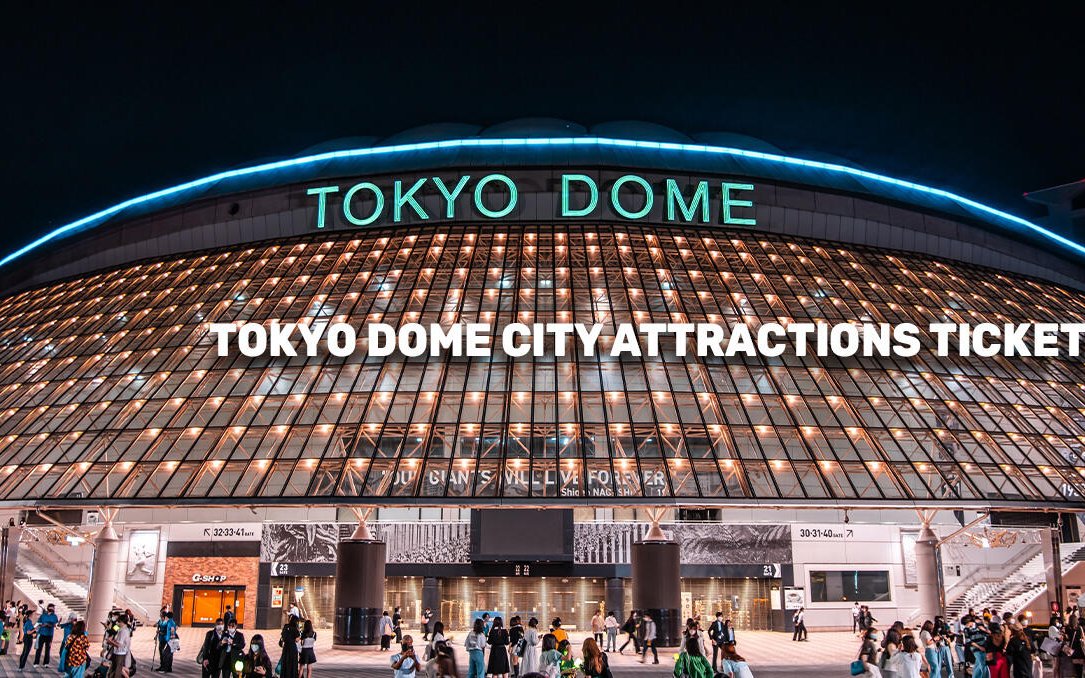 Tokyo Dome entrance illuminated at night, promoting city attractions ticket.
