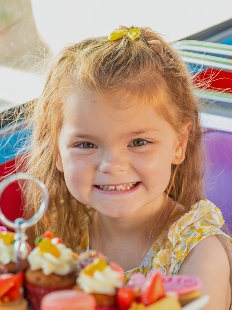 Child enjoying treats on Peppa Pig themed bus tour, Brigit’s Afternoon Tea Bus Tour.