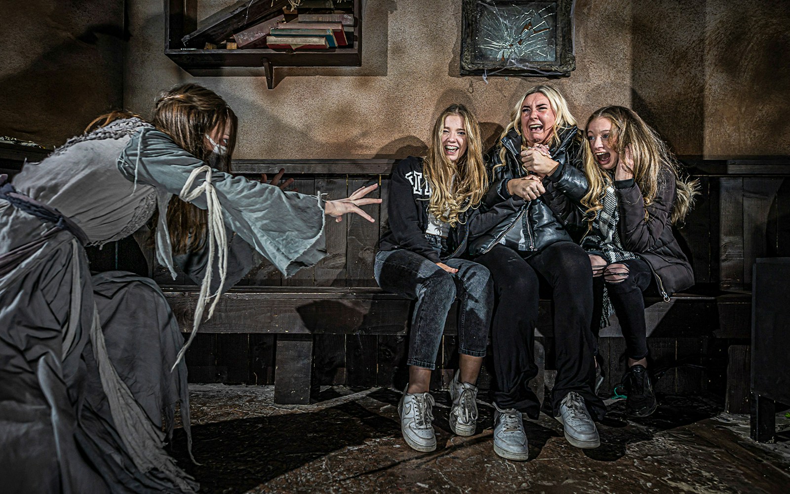 Visitors exploring the amsterdam Dungeon, featuring immersive historical exhibits.