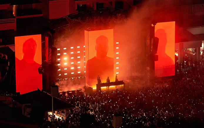 Swedish House Mafia performing at Ushuaïa Ibiza with vibrant stage visuals.