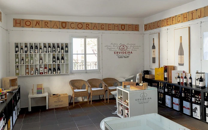 Ervideira Wine Shop interior with wine bottles on display in Monsaraz, Portugal.