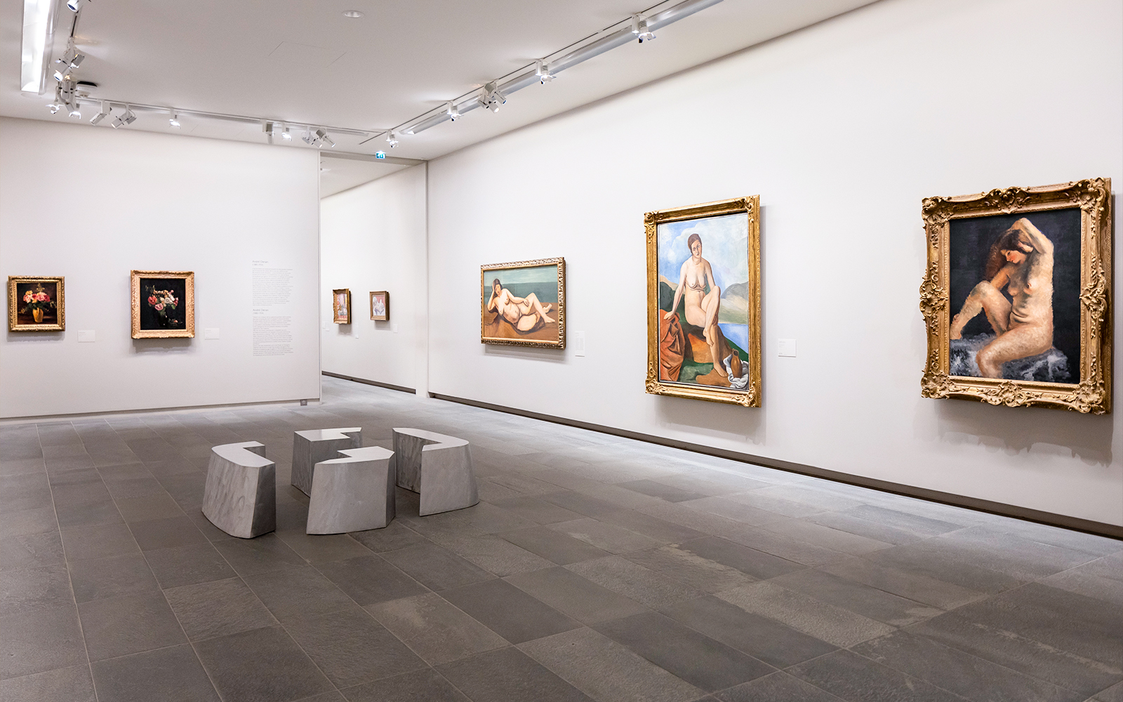 Artworks displayed inside Orangerie Museum, Paris, featuring classic paintings.