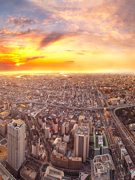 Aerial view of Osaka cityscape at sunset from Harukas 300 Observatory.