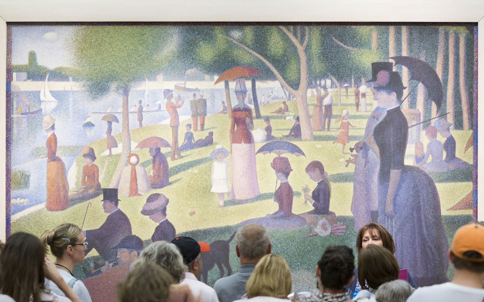 People viewing Georges Seurat's painting at The Art Institute of Chicago.