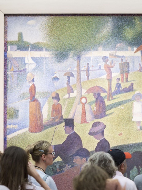 People viewing Georges Seurat's painting at The Art Institute of Chicago.