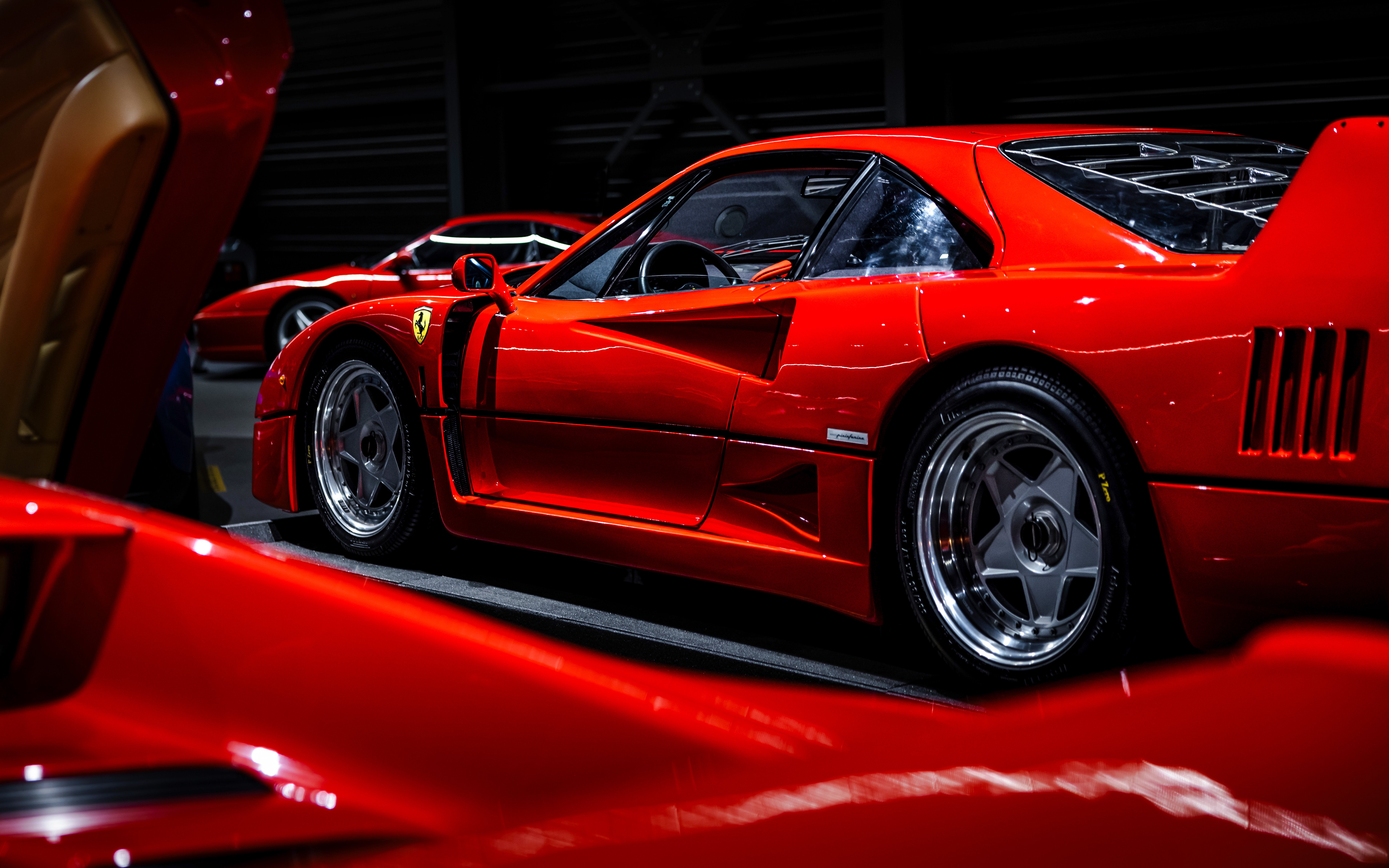 Red sports car on display at Coligny Car Museum, Lyon, France.