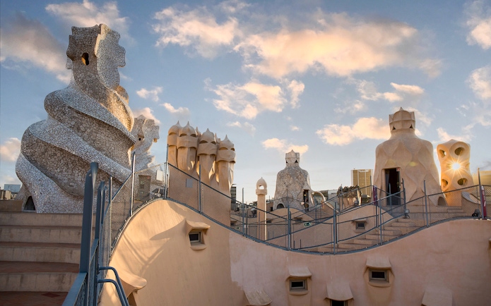 Casa Milà rooftop chimneys at sunrise during La Pedrera tour in Barcelona.