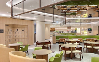 Sky Hub Lounge West seating area with tables, chairs, and luggage lockers.