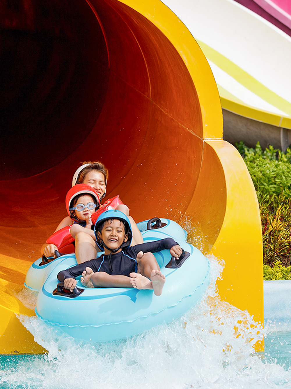 Children enjoying a water slide at Caribe Aquatic Park.
