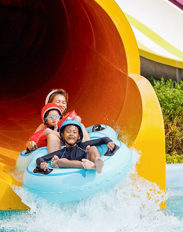 Children enjoying a water slide at Caribe Aquatic Park.