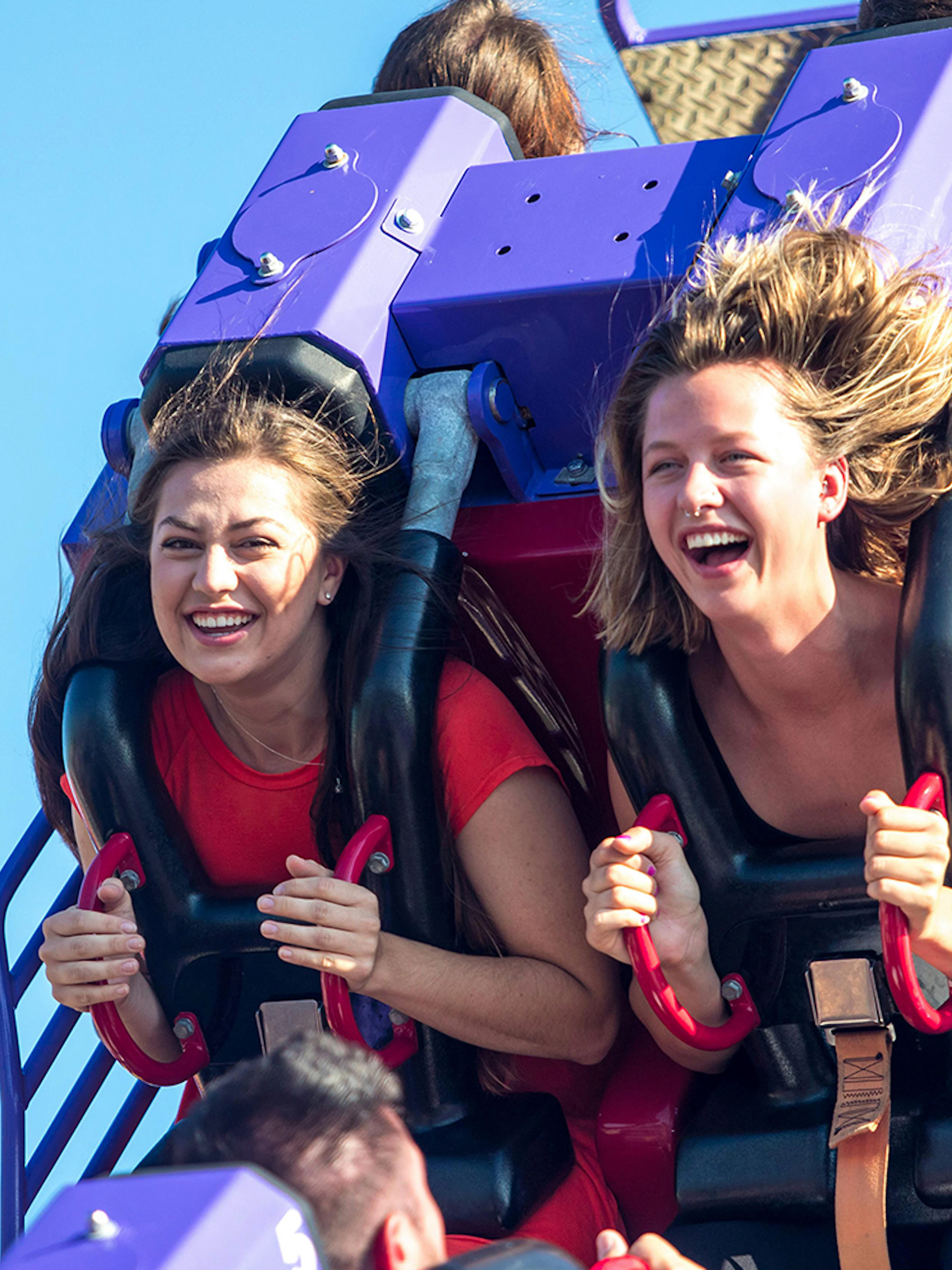 Visitors enjoying the Rolling Thunder ride at Frontier City amusement park.