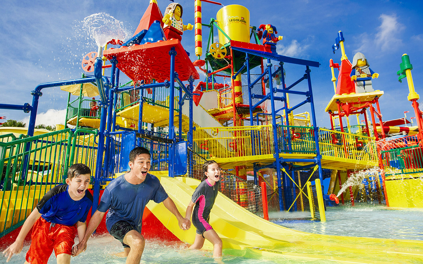 Family enjoying Joker ride at Legoland Malaysia water park.