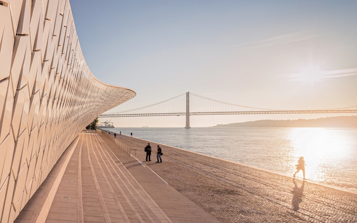 MAAT building by the Tagus River with bridge in Lisbon.