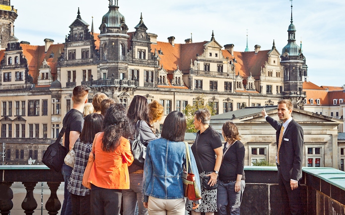 Tour group with guide at Dresden's Semperoper during Altstadtrundgang.