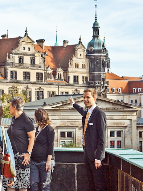Tour group with guide at Dresden's Semperoper during Altstadtrundgang.