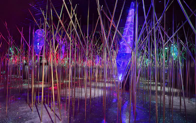 Swarovski Crystal Worlds installation with colorful lights and reflective surfaces.