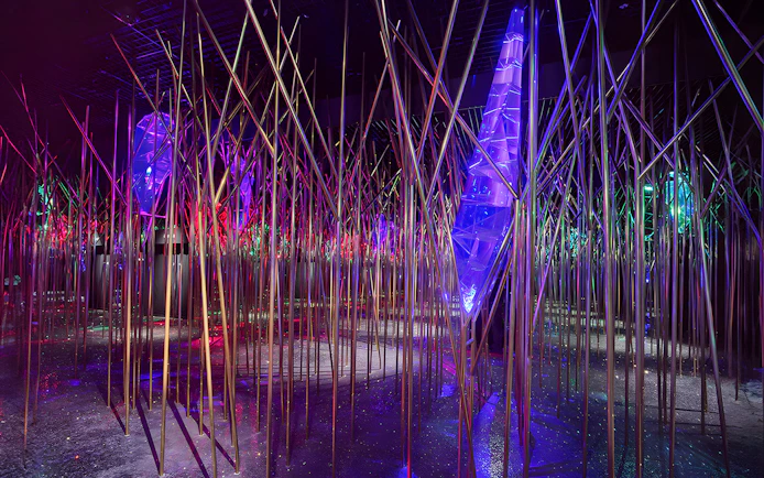 Swarovski Crystal Worlds installation with colorful lights and reflective surfaces.