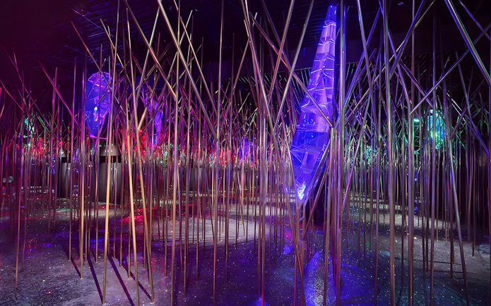 Swarovski Crystal Worlds installation with colorful lights and reflective surfaces.