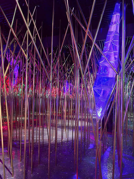 Swarovski Crystal Worlds installation with colorful lights and reflective surfaces.