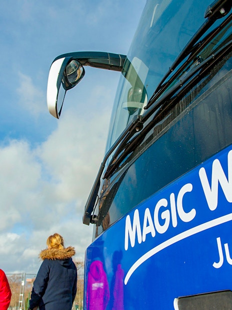 Shuttle bus near Eiffel Tower for Disneyland® Paris tour.