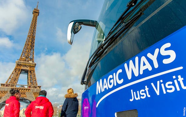 Shuttle bus near Eiffel Tower for Disneyland® Paris tour.