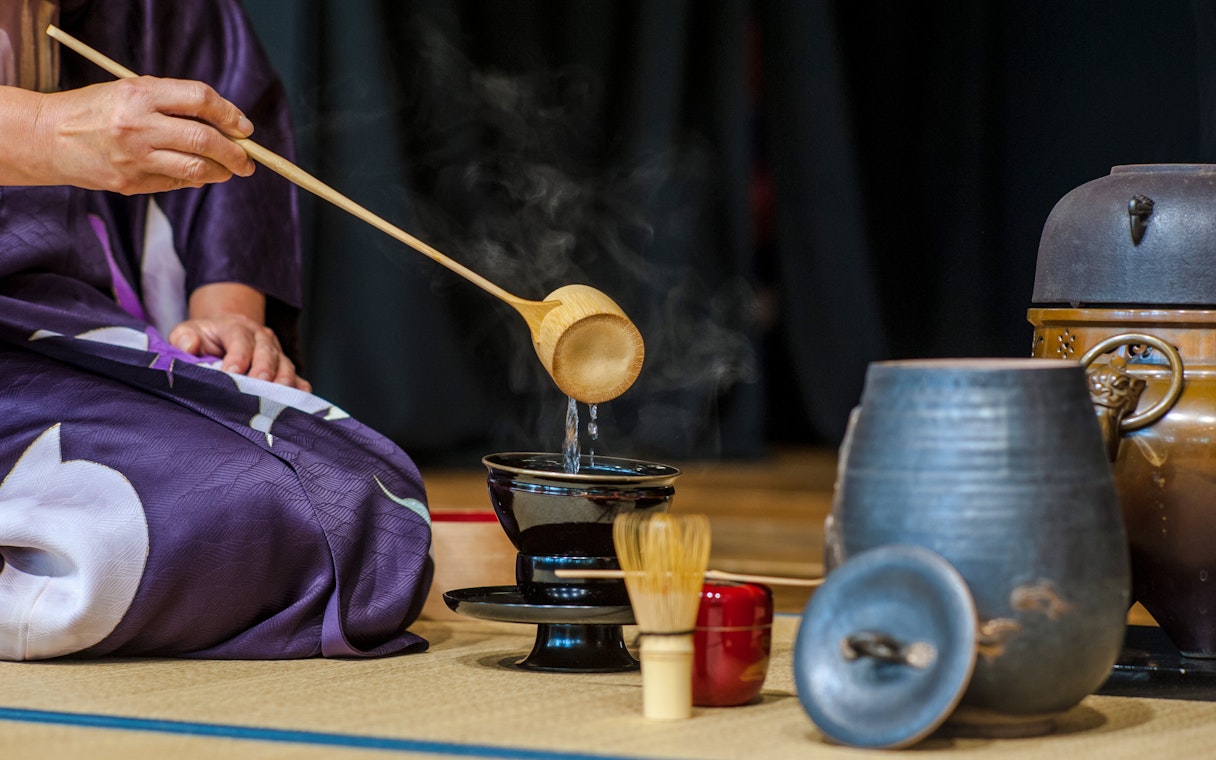 Pouring water during a traditional tea ceremony in Kyoto, Japan.