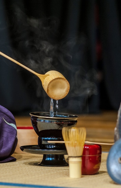 Pouring water during a traditional tea ceremony in Kyoto, Japan.
