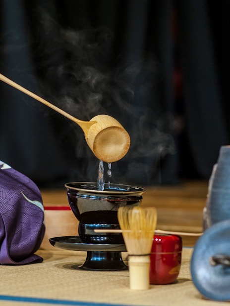 Pouring water during a traditional tea ceremony in Kyoto, Japan.
