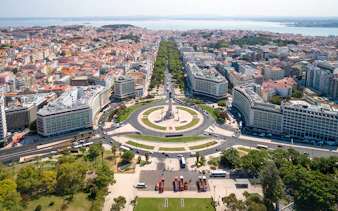 Aerial view of Lisbon's Marquês de Pombal Square with surrounding cityscape, part of Lisbon & Belém tour.