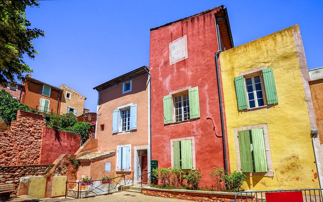 Colorful buildings in Roussillon, Provence, seen on a full-day guided tour from Avignon.