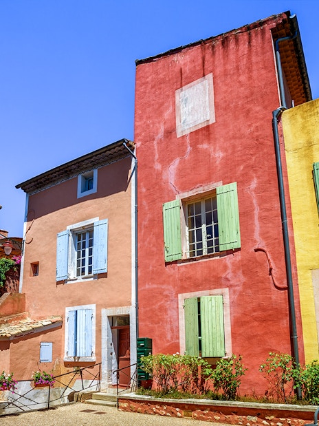 Colorful buildings in Roussillon, Provence, seen on a full-day guided tour from Avignon.